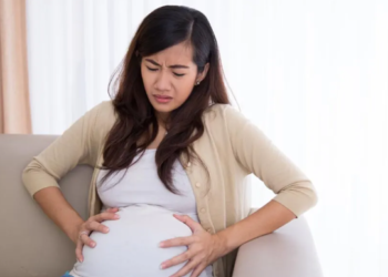 Why is the risk of urinary tract infections increased in pregnant women?