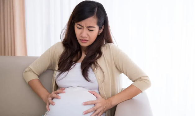 Why is the risk of urinary tract infections increased in pregnant women?