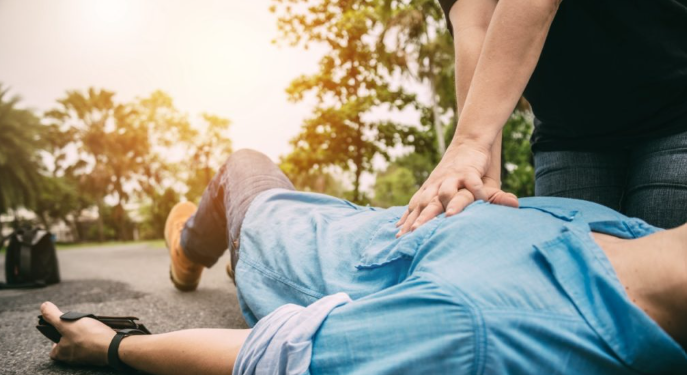 CPR administered on the road to a man who collapsed from a heart attack; nurses praised for their heroic effort.